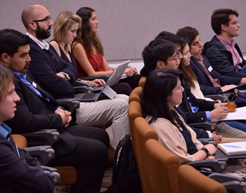 Students listening to alumni speak