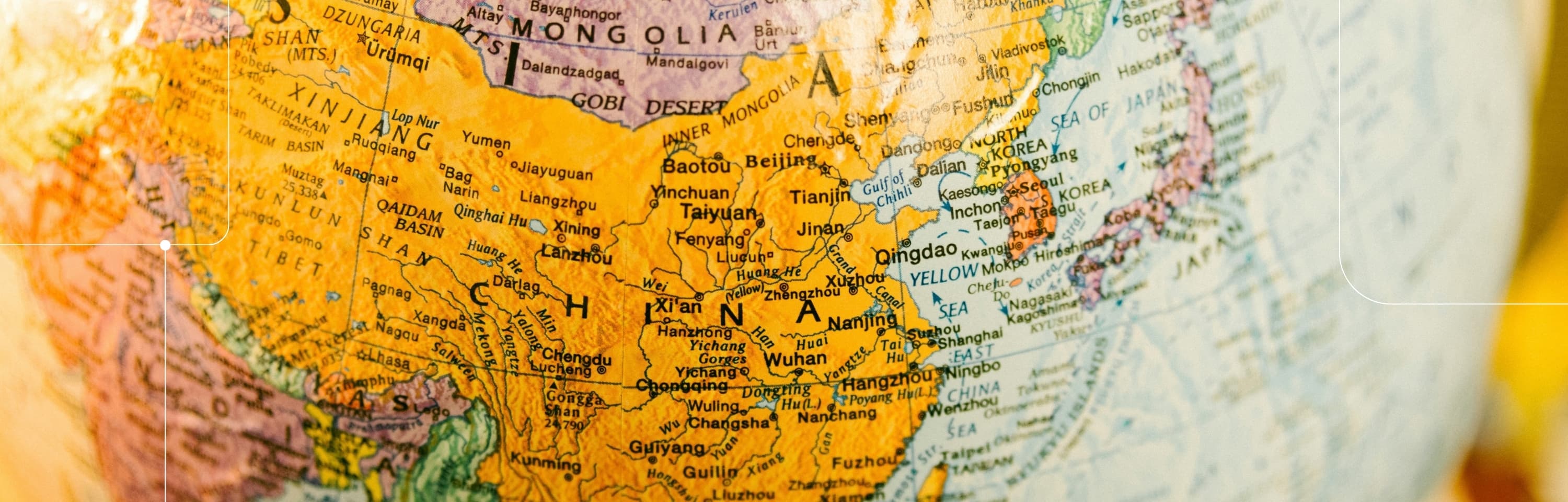 A close-up, high-detail view of a political world globe focusing on East Asia, including China, Japan, and the surrounding regions.