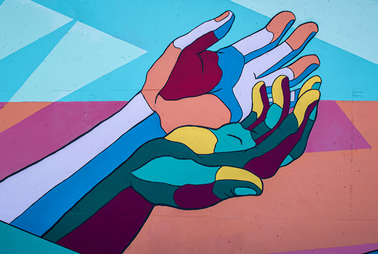 Colorful Hands 2 of 3 / George Fox students Annabelle Wombacher, Jared Mar, Sierra Ratcliff and Benjamin Cahoon collaborated on the mural. Photo by Tim Mossholder on Unsplash