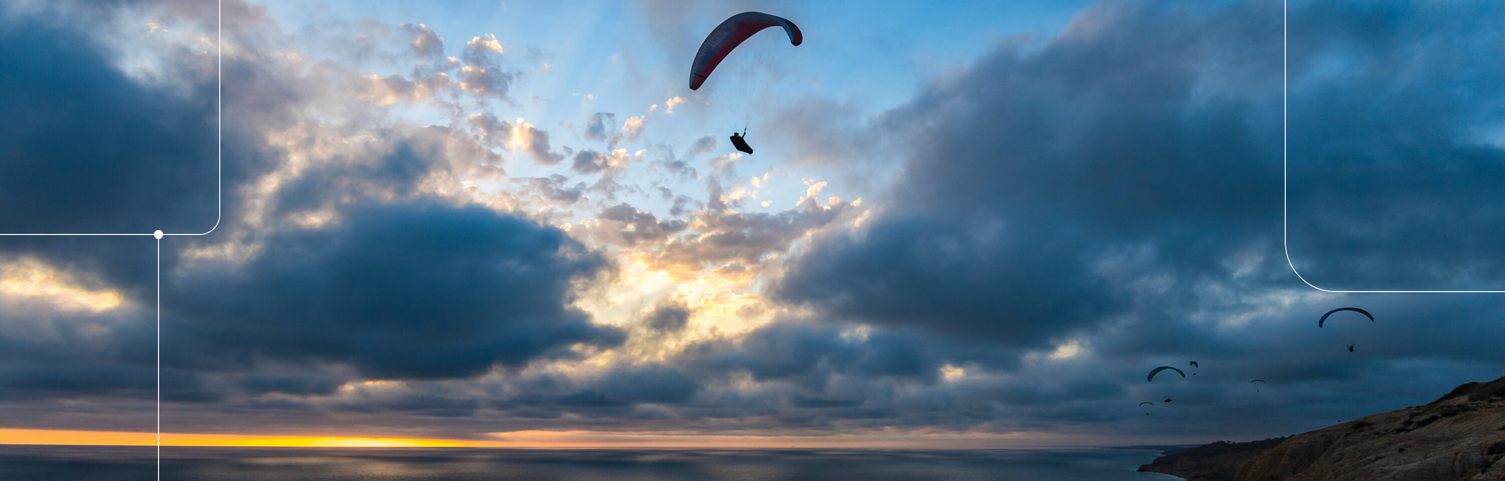 Sunset sky with hang gliders at La Jolla